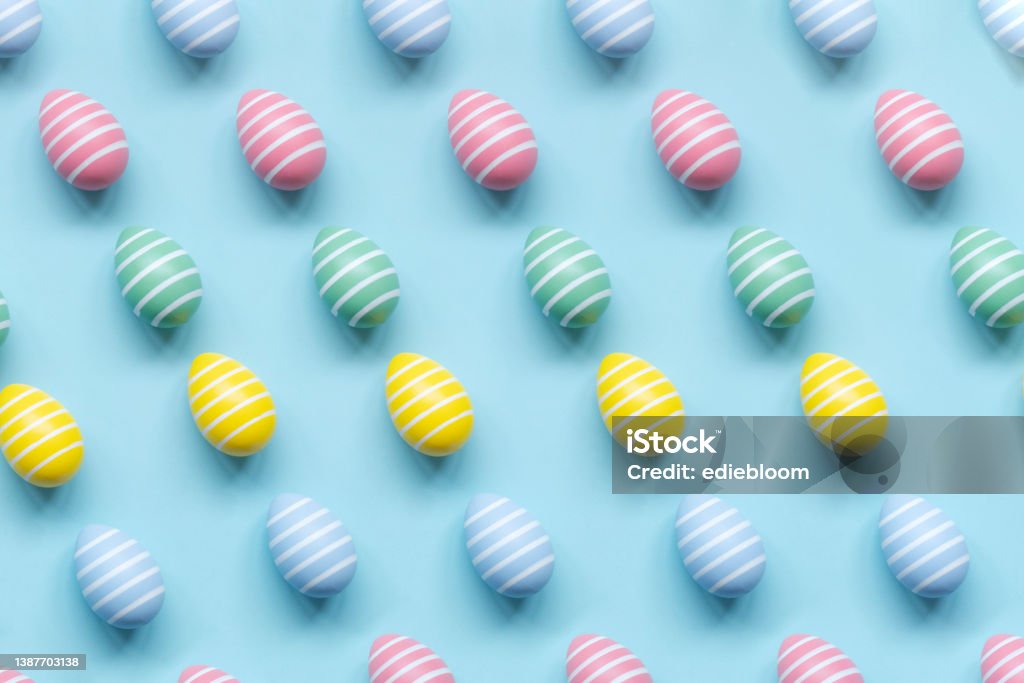 Painted Easter eggs pattern Painted Easter eggs pattern on blue background Easter Egg Stock Photo