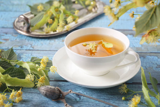istock Cup of herbal tea with linden flowers 1387703224