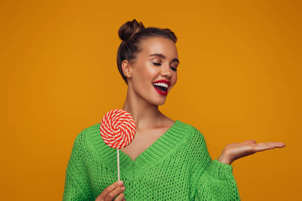 Beautiful woman with big lollipop