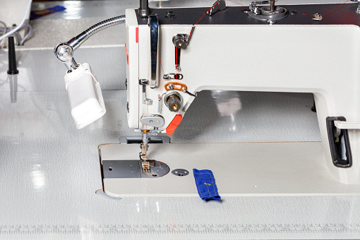 Industrial sewing machine for sewing clothes from various fabrics.