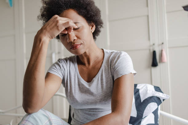 unhappy african-american woman suffering from depression - mid adult women imagens e fotografias de stock