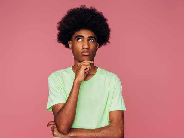 istock Portrait of emotional afro guy 1387711086