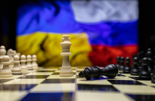istock War between Russia and Ukraine, conceptual image of war using chess board, pieces and national flags on the background 1387711499
