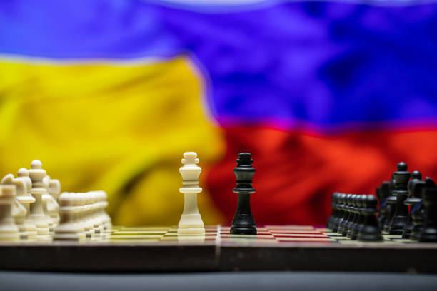 istock War between Russia and Ukraine, conceptual image of war using chess board, pieces and national flags on the background 1387711522