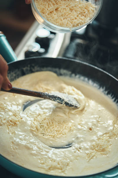 istock Preparing Fettuccine Pasta Alfredo with Parmesan 1387714043