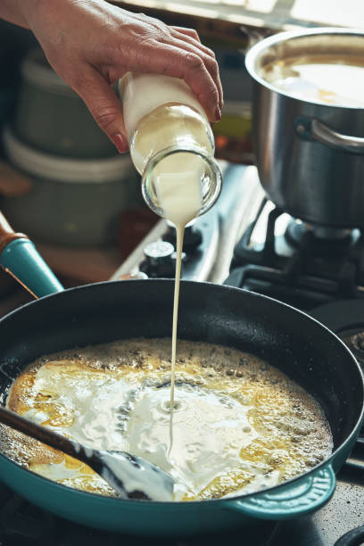 istock Preparing Fettuccine Pasta Alfredo with Parmesan 1387714110
