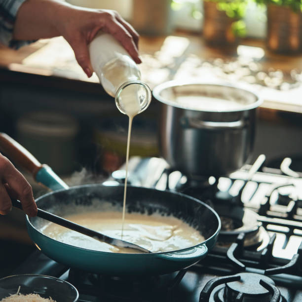 istock Preparing Fettuccine Pasta Alfredo with Parmesan 1387714112