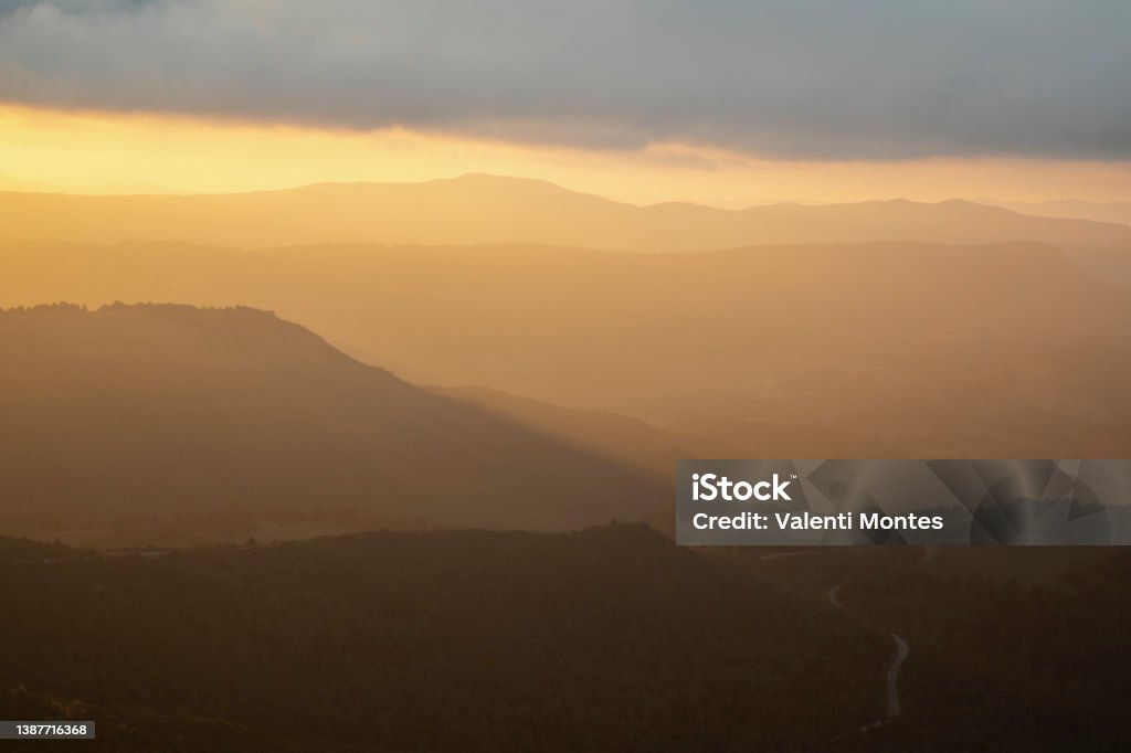 Layers of mountains landscape Orange landscape showing some mountains covered by mist Catalonia Stock Photo