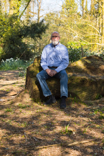 istock Elderly man out for a walk 1387717769