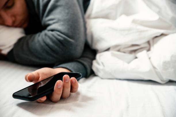 istock Always holding phone in hand 1387717825