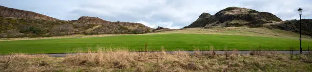 Photo of panoramic view of the highest peak in the scottish capital Edinburgh Arthur's seat, named after King Arthur