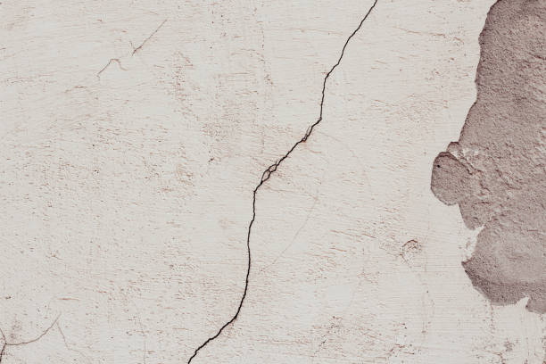 istock textured cracked white old wall background for copy space 1387722660