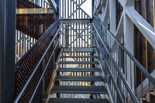 Steel construction with stainless metal railing and fall protection.