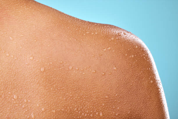 istock Studio shot of a woman posing with water droplets on her back 1387732971