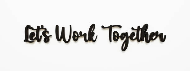 istock Let's work together. Handwritten dark letters against white background. 1387733718