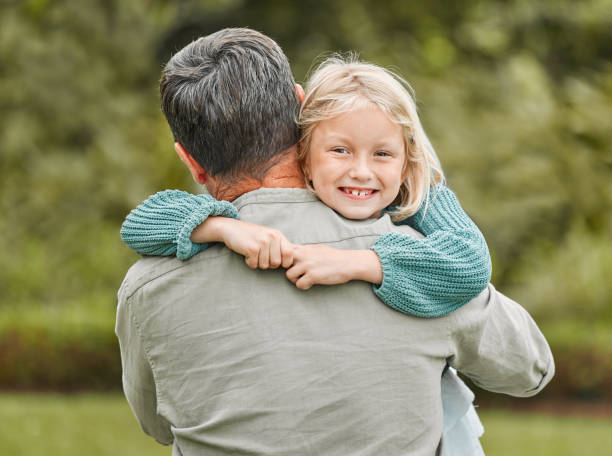 istock Shot of a father spending time outdoors with his young daughter 1387734691