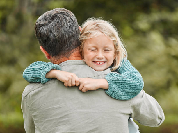 istock Shot of a father spending time outdoors with his young daughter 1387734700