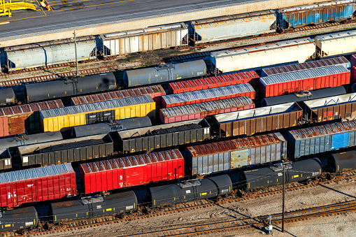 Freight cars lined up on multiple tracks in a major rail yard just outside of downtown Mobile, Alabama shot from an altitude of about 600 feet.
