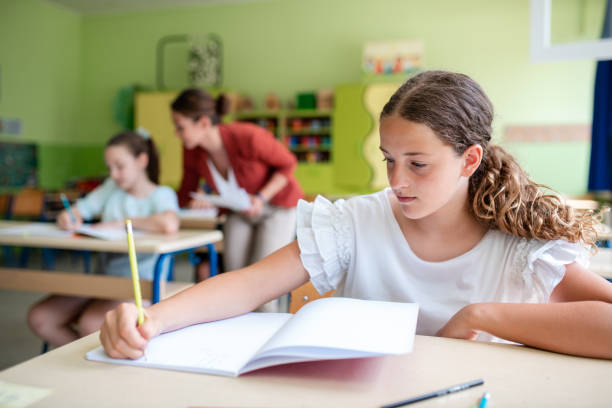 istock School girl in classroom 1387738641