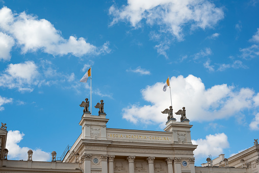 Lund, Sweden, September 21, 2016:  View of the roof of the Lund University main building, built in 1882, University Royal Caroline Academy, Lund in the province of Scania, Sweden. Beautiful clouds on blue sky.