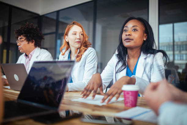 istock Doctors exchange opinions on the treatment that should be applied to patients. 1387746049