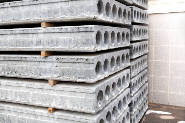 istock Stack of Prefabricated concrete slabs with hole for construction. 1387746117