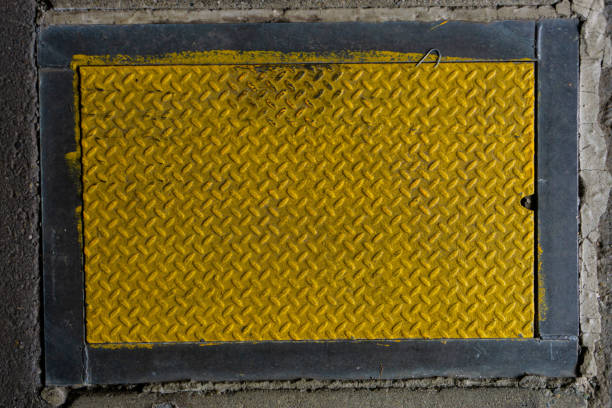 Yellow and Gray Box with Criss Cross Texture on Cement