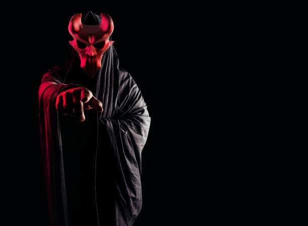 istock Occult horror sectarian with metal mask on black background. 1387752212