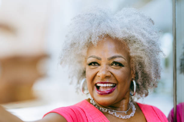 istock Young minded smiling senior woman 1387753720