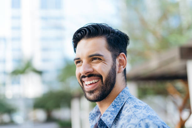 istock Portrait of a smiling hipster man 1387753722