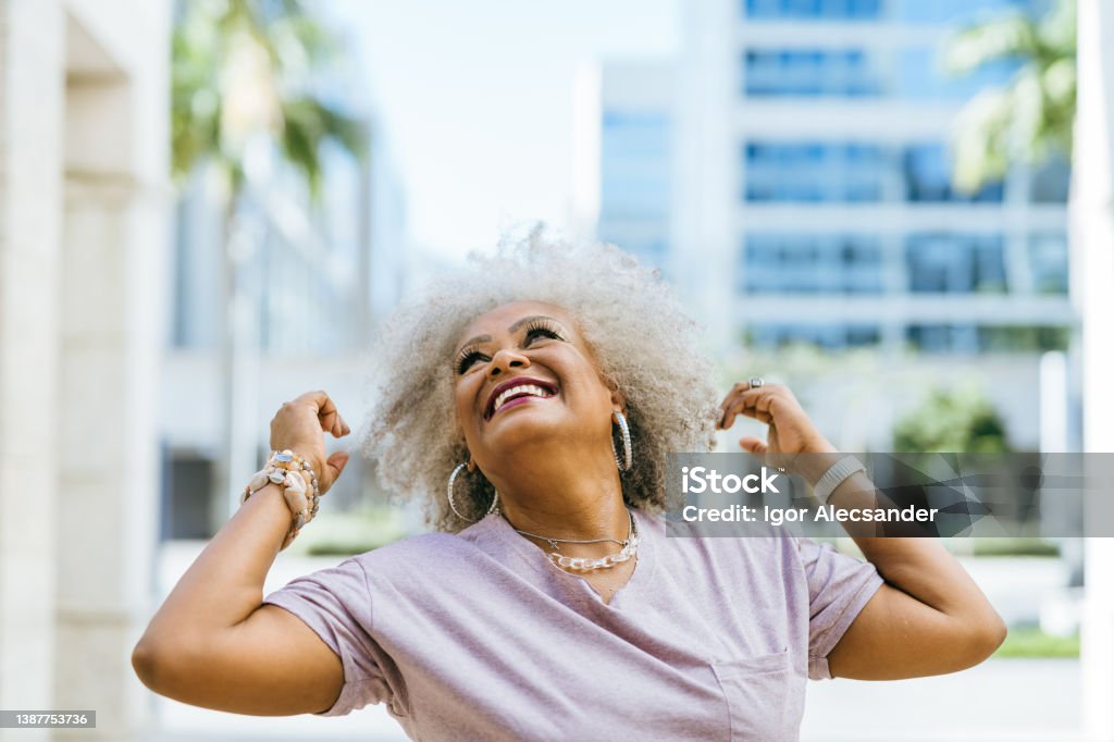 Positive senior woman in the city Fashion Stock Photo