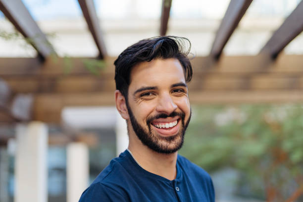 istock Portrait of a smiling young man 1387753781