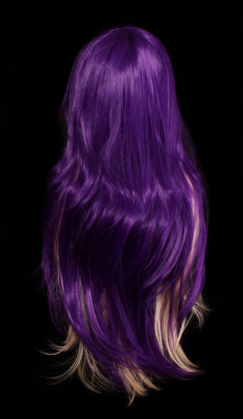 istock Purple and Blond Wig on Black Background 1387756861