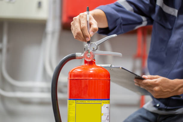 istock Engineer are checking and inspection a fire extinguishers tank in the fire control room for safety training and fire prevention. 1387759669