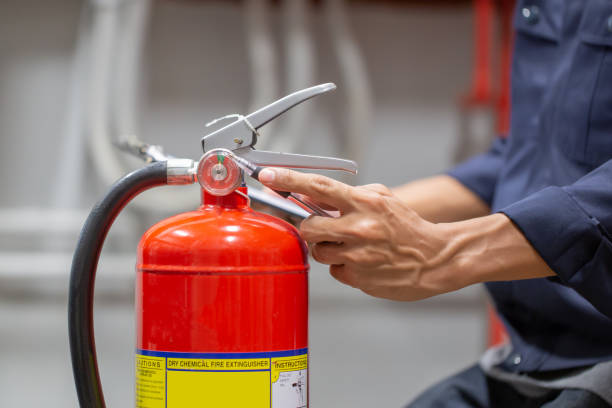 istock Engineer are checking and inspection a fire extinguishers tank in the fire control room for safety training and fire prevention. 1387759672