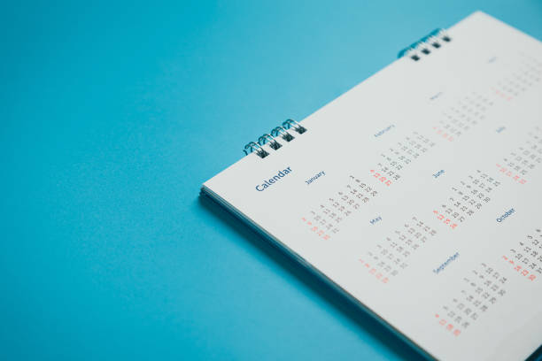 istock Close top view on white calendar 2022 month schedule Work planning and life concept. 1387759795