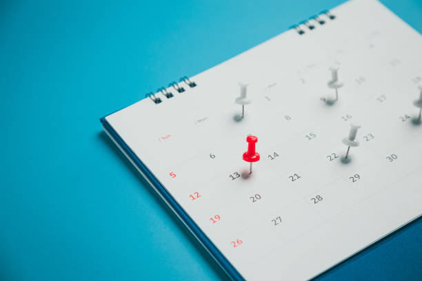 istock Close top view on white calendar 2022 month schedule Work planning and life concept. 1387760340