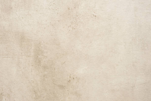 istock Brown concrete stone surface paint wall background, Grunge cement paint texture backdrop, White rough concrete stone wall background, Copy space for interior design background, banner, wallpaper 1387763674