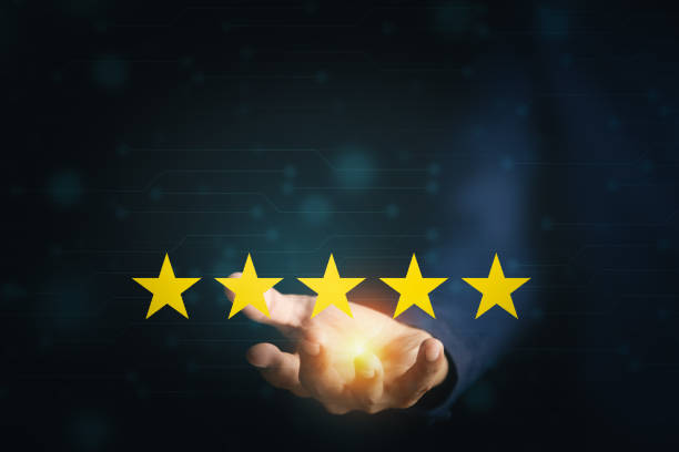 istock Customer Service and Satisfaction Concept Businessmen touch the virtual screen on happy smiley icons to achieve service satisfaction and feedback with excellent rated reviews. 1387764548