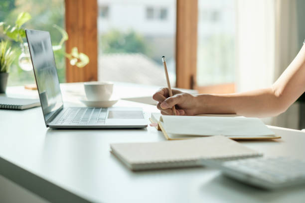 istock E-learning ,online ,education and internet social distancing protect from COVID-19 viruses concept. Asian woman student video conference e-learning with teacher on laptop at home. 1387768745