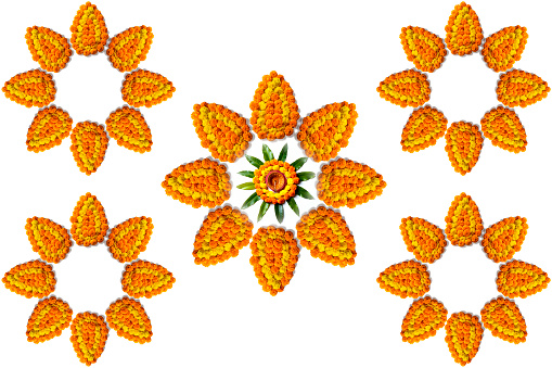 Marigold Flower rangoli Design with oil lamps for Diwali Festival.