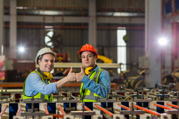 Foreman or worker work at factory site check up machine or products in site. Engineer or Technician checking Material or Machine on Plant. Industrial and Factory.