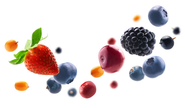 Many different berries in the form of a frame on a white background stock photo