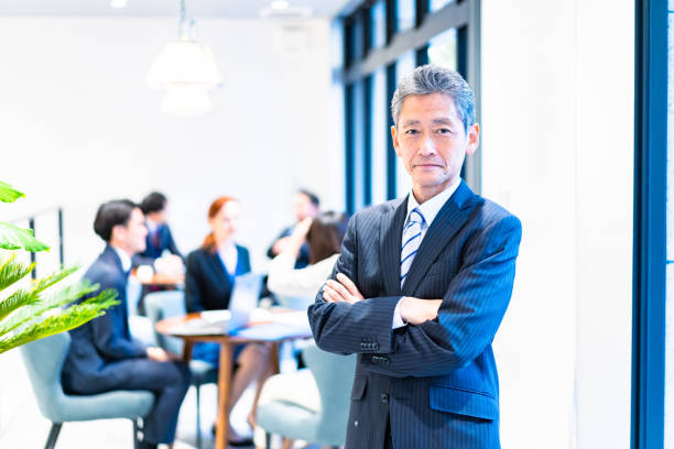 istock Elderly businessperson working with a smile 1387775505