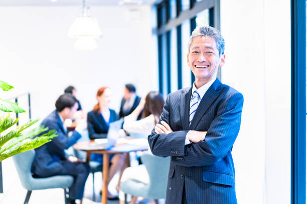 istock Elderly businessperson working with a smile 1387775509