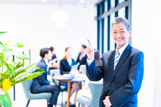 istock Elderly businessperson working with a smile 1387775520