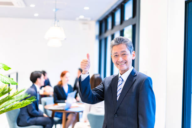 istock Elderly businessperson working with a smile 1387775522