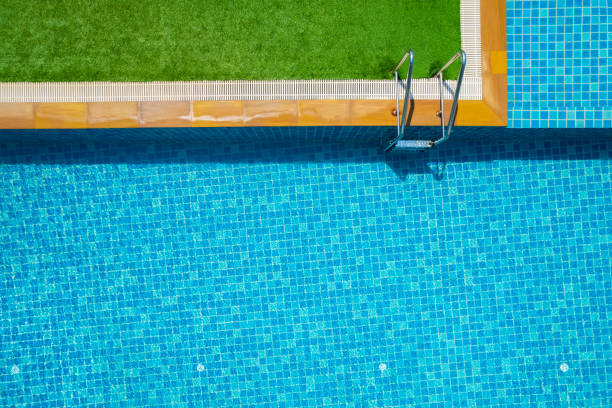 istock Swimming pool top view background. Pool villa. 1387776112