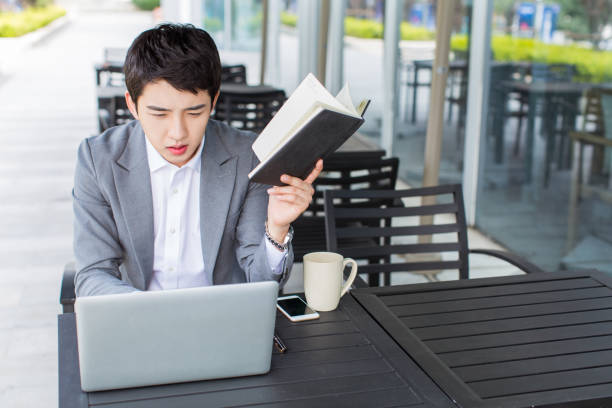 istock young chinese businessman, IT elite 1387777251