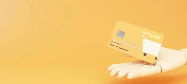 Photo of Close up wood cartoon hand holds levitating shopping online card design template mockup Bank credit card with online service isolated on yellow background 3d rendering illustration